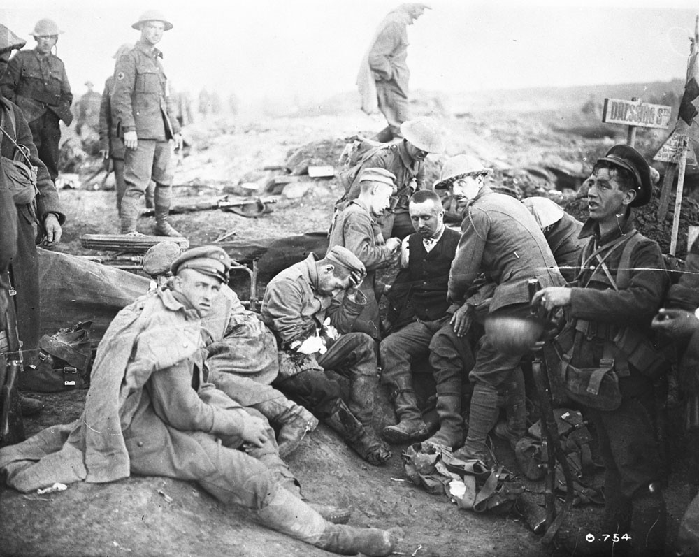 Canadians savages. Attending to wounded Germans at advanced dressing station. Battle of Flers-Courcelette, 15 September 1916. MIKAN No. 3395797