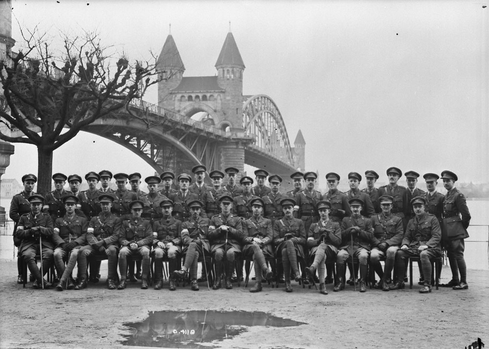 Signal Officers, 1st & 2nd Cdn. Divs. & Corps H.Q. alongside Bonn Bridge. 5 January 1919. MIKAN No. 3405817