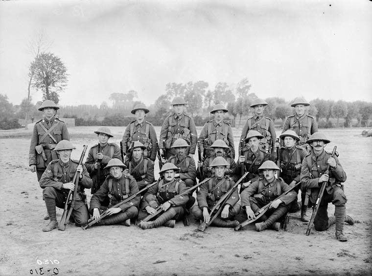 Signallers (2nd Battalion, Cdn. Expeditionary Force) at Scottish Lines near Poperinghe, not far from Ypres. This photo was taken by an Official War Photographer while the 2nd Bn. was out in Rest Billets after fighting at Sanctuary Woods, Maple Copse. MIKAN No. 3405887 Guy Wray Garrett was a signaller with 1st C.M.R.