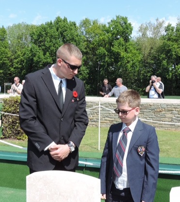 Great-great-great-nephew Hudson Alexander Gough Krochak and Fabien Demeusere. Hudson and Fabien have just laid flowers on the grave of Clifford Abram Neelands, 13 May 2015, Caix British Cemetery.