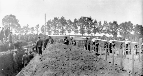 Funeral of Canadian nurses killed during a raid on a Canadian hospital by German airmen - RH panorama. Burial scene - Bagneux British Cemetery - Three Nursing Sisters - Bishop Michael Francis Fallon presiding. MIKAN No. 3394939