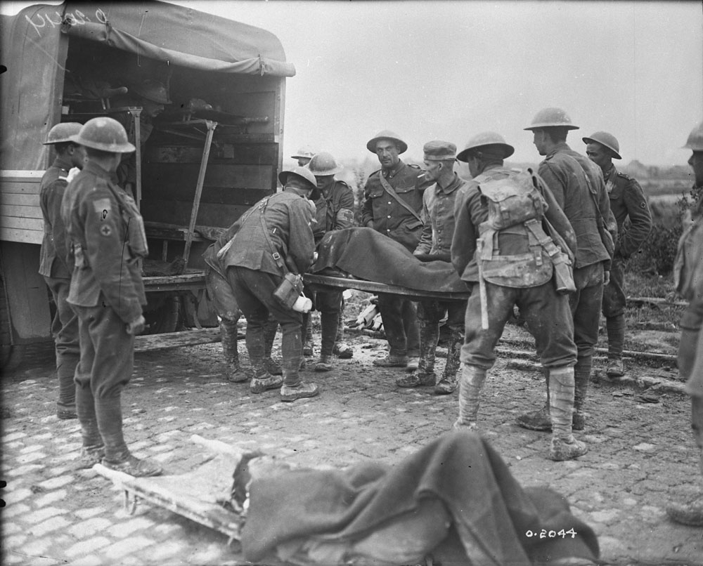 Canadian wounded being placed in Ambulance during advance on Lens, October 1917. MIKAN No. 3397028