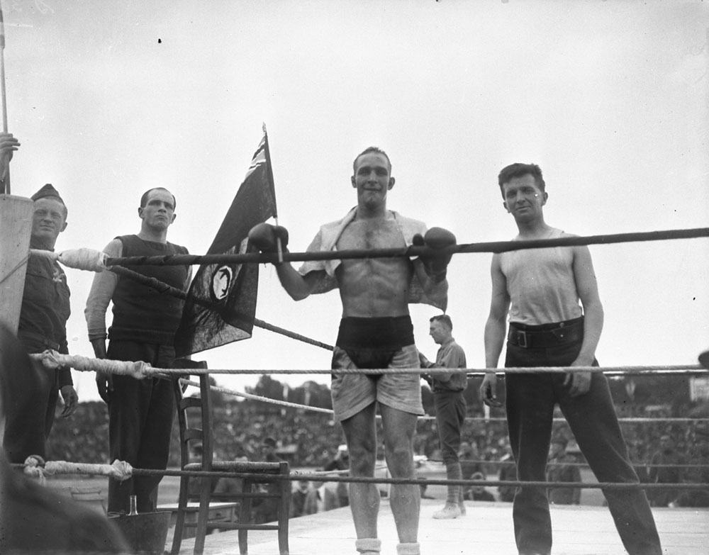 Sergeant Joseph Attwood keeps the Canadian flag flying. Inter-Allied Games, Pershing Stadium, Paris, July 1919. MIKAN No. 3384725