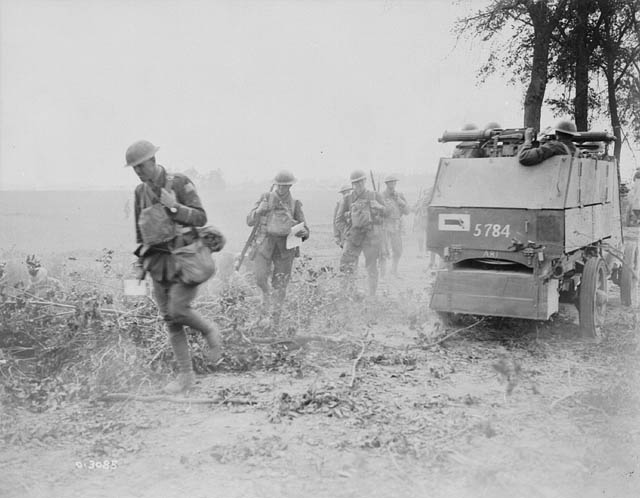 Canadian armoured cars going into action at the Battle of Amiens. MIKAN No. 3194818